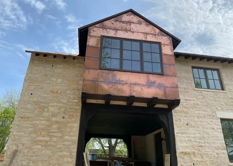 Copper metal panel facade on a stone building for Metal Roof Coating in Vernon Hills