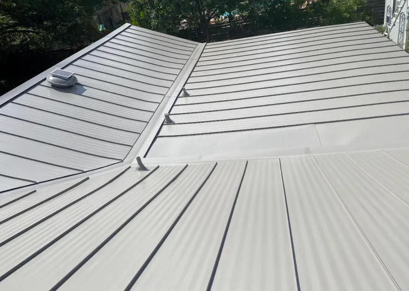 Solar attic fan installed on a metal roof for Roof Ventilation in Vernon Hills